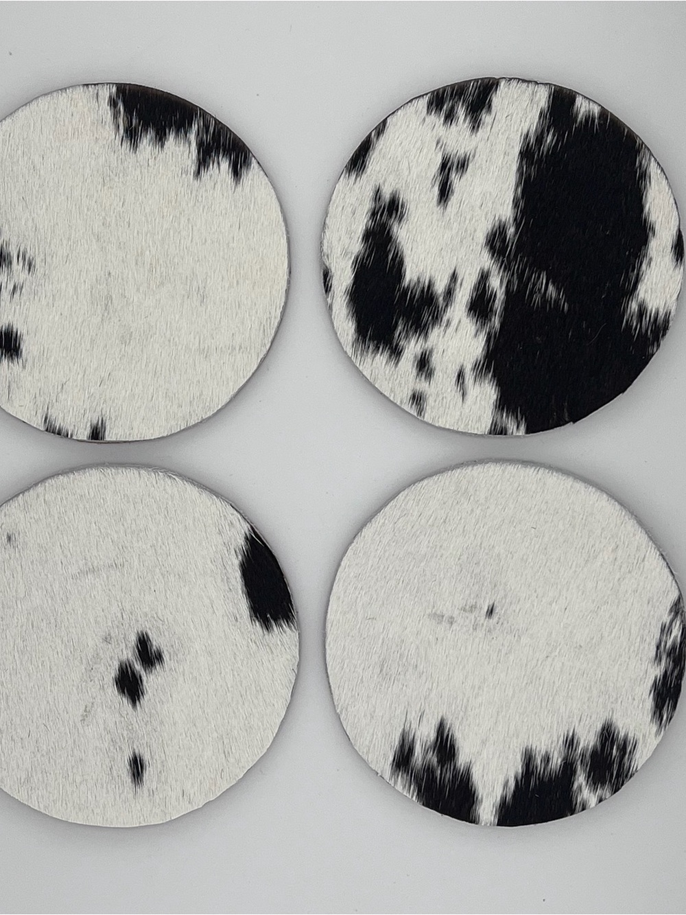 Black and White Cowhide Round Coasters - Set of 4